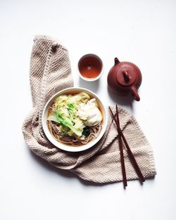 High angle view of food on table against white background