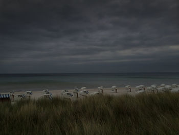 Scenic view of sea against cloudy sky