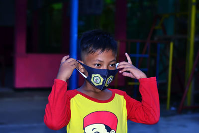 Portrait of a boy wearing a mask