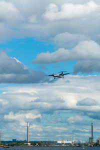 Low angle view of airplane flying in sky