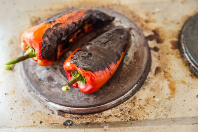 Close-up of meat on barbecue grill in kitchen