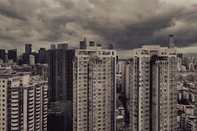 Aerial view of modern buildings in city against sky