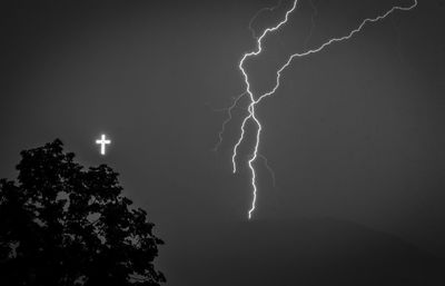 Low angle view of lightning in sky at night