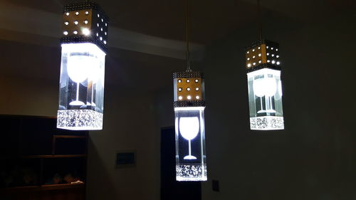 Low angle view of illuminated lighting equipment