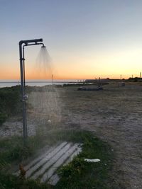 Scenic view of sea against clear sky during sunset