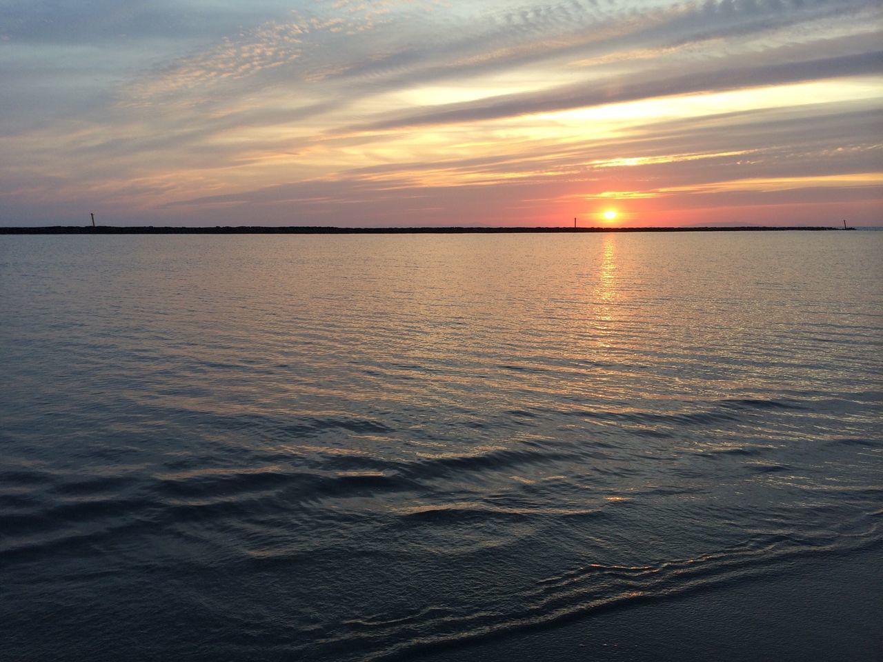 sunset, water, sea, tranquil scene, scenics, sun, beauty in nature, tranquility, sky, horizon over water, reflection, orange color, idyllic, nature, sunlight, cloud - sky, rippled, beach, silhouette, waterfront