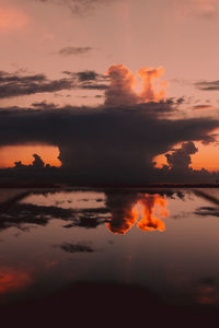 Scenic view of lake against romantic sky at sunset