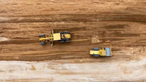 Aerial view motor grader civil at construction site, motor grader work on construction site, road