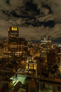 High angle view of illuminated buildings in city at night