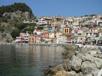 Town by sea against clear sky