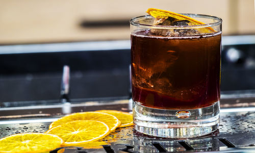 Close-up of glass of ice tea on table