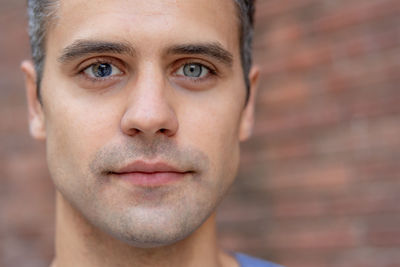 Close up portrait of latin man with heterochromia