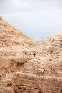 Scenic view of arid landscape against sky