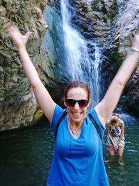 Portrait of woman with sunglasses in water