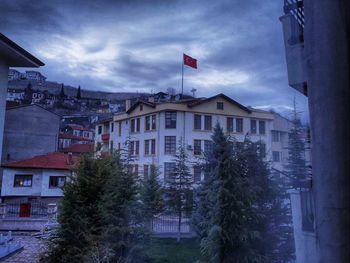 Buildings in town against sky