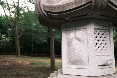 Close-up of cross in park