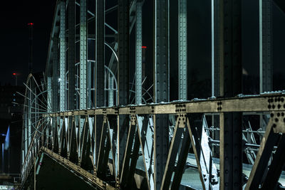 Illuminated metallic bridge at night