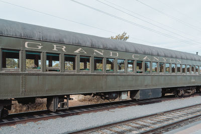 Train at railroad station against sky