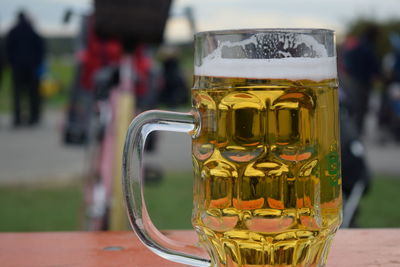 Close-up of beer glass on table