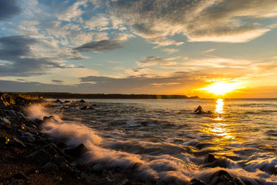 Scenic view of sea against sky during sunset