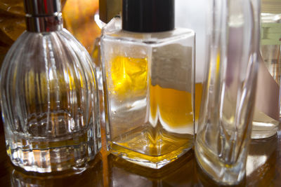 Close-up of perfumes on table