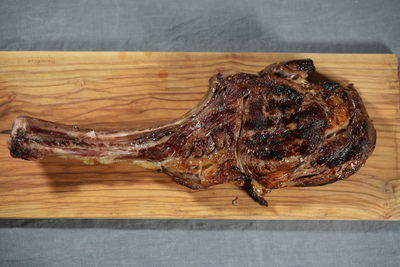 Tomahawk steak on wooden board