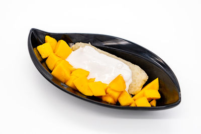 Close-up of yellow fruit in plate