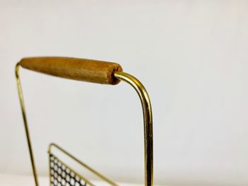 Close-up of faucet against white background