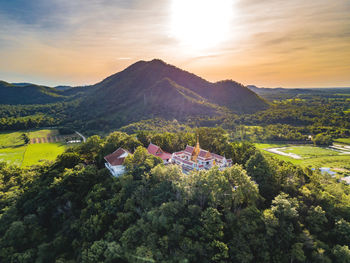 High angle view of trees and mountains against sky