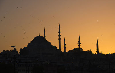 Panoramic view of temple building against sky during sunset