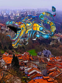 High angle view of city buildings against sky