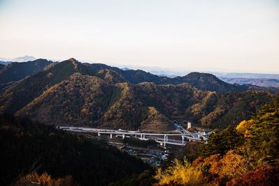High angle view of bridge over mountains against sky