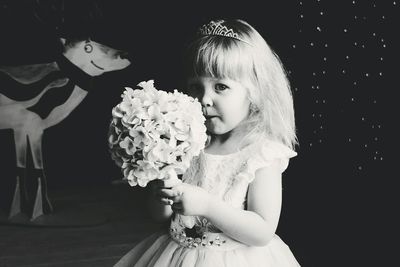 Close-up portrait of girl with flowers