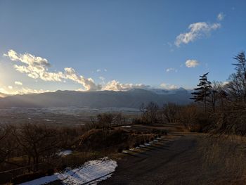 Scenic view of landscape against sky during winter