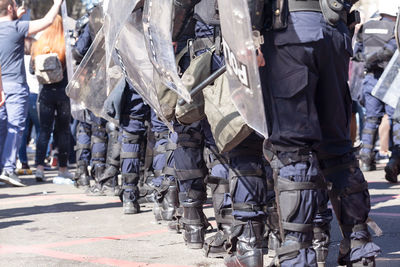 Police force standing on street