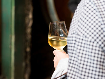 Close-up of woman holding wineglass