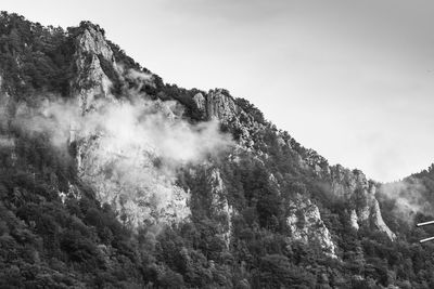 Low angle view of mountain range against sky