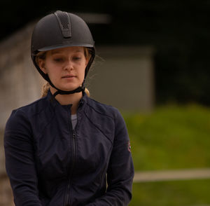 Portrait of young girl wearing a helmet