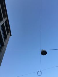 Low angle view of built structure against clear blue sky