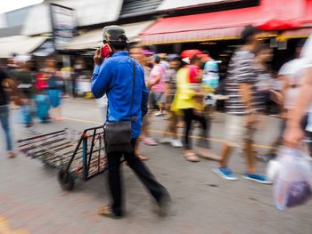 People walking on road in city