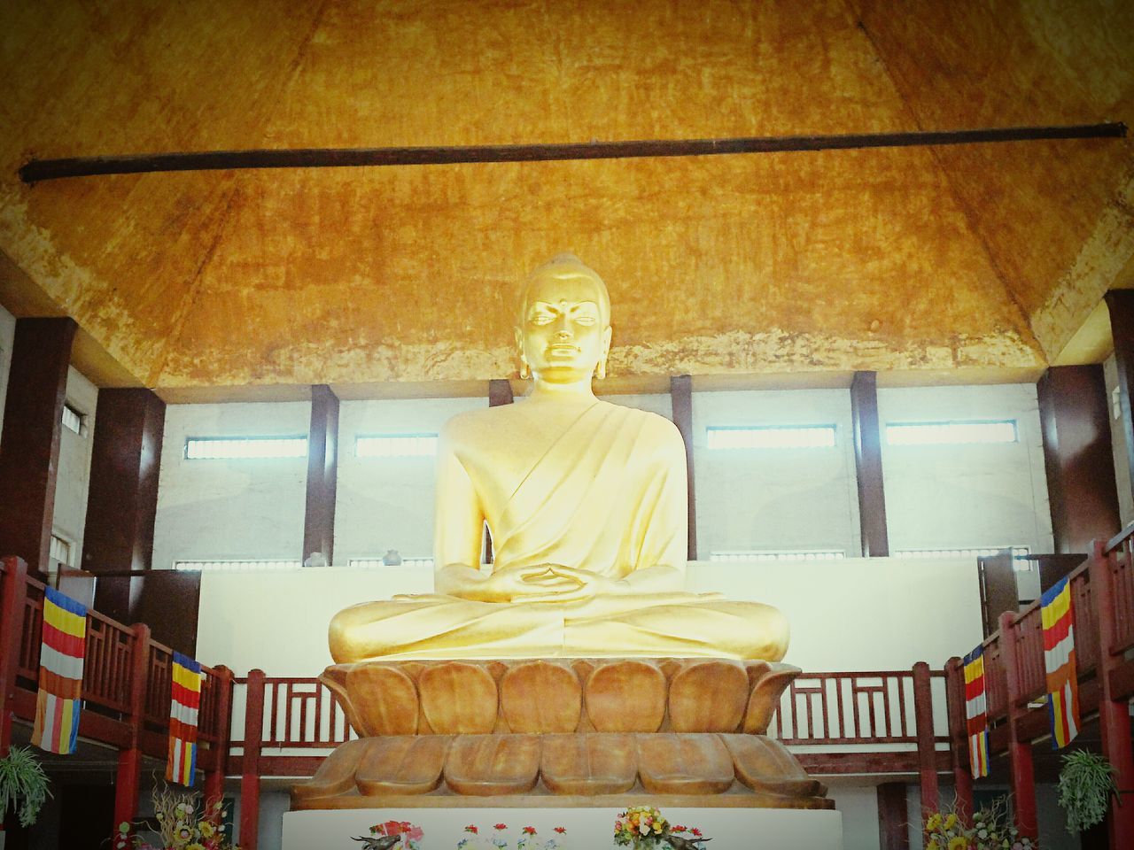 statue, human representation, art and craft, sculpture, art, indoors, creativity, religion, place of worship, spirituality, architecture, built structure, temple - building, low angle view, buddha, no people