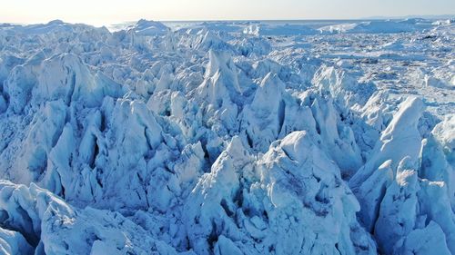 Panoramic view of snowcapped mountains against sky