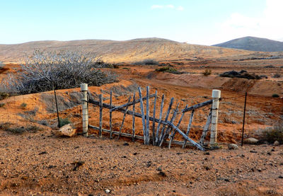 Scenic view of arid landscape against sky