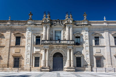 Low angle view of historical building against blue sky