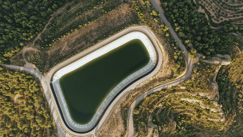 Aerial view of mountaintop reservoir at dusk