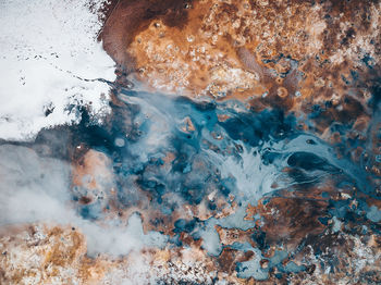 Close-up of rocks in sea during winter