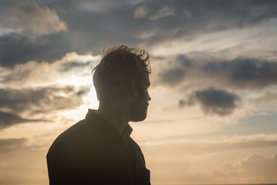 Portrait of man against sky during sunset