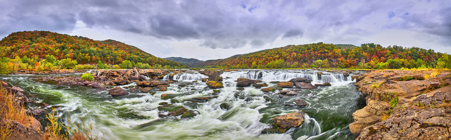 Panorama of sandstone falls in west virginia with fall colors.