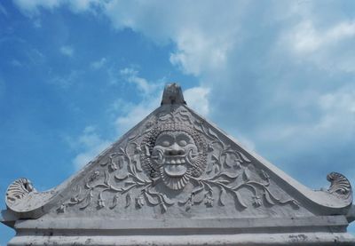 Low angle view of statue against sky