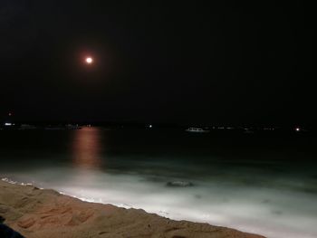 Scenic view of lake at night